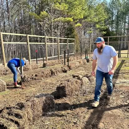 Olin and Concetta working in the garden